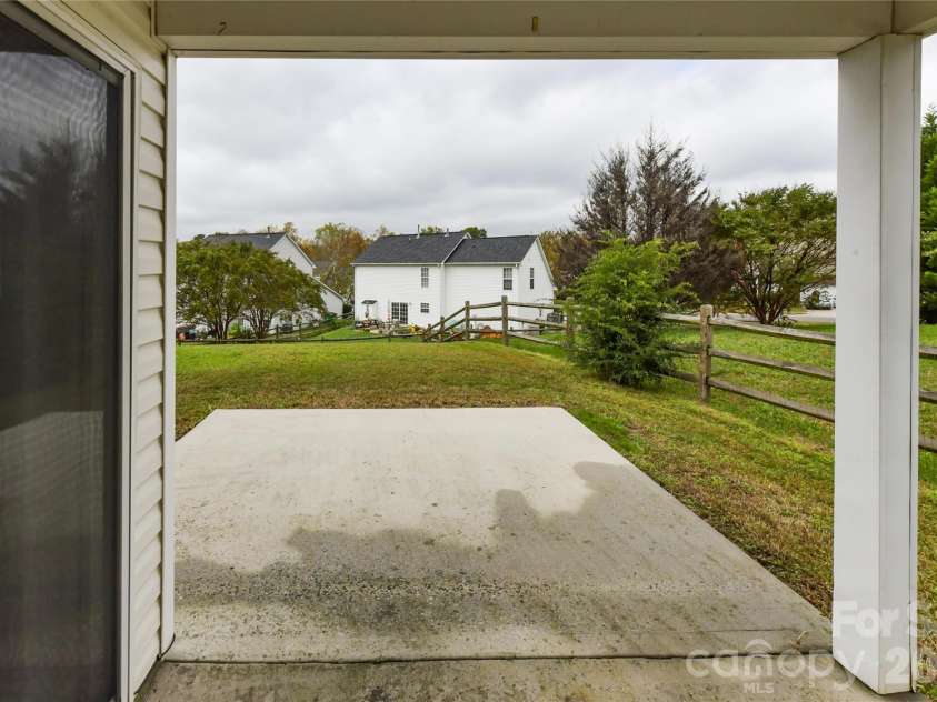 11927 Cheviott Hill Lane, Charlotte, NC 28213.  MLS# CAR4389997, YatesRealty ID 27980. Back covered patio