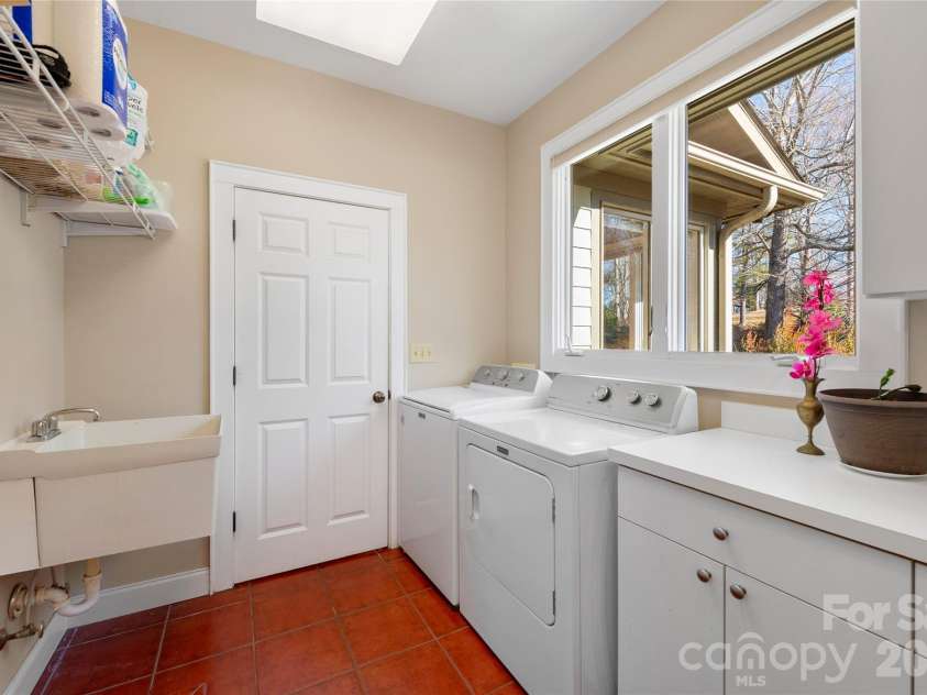 1552 Bear Creek Road, Leicester, NC 28748.  MLS# CAR4340462, YatesRealty ID 2799. Functional and spacious laundry
