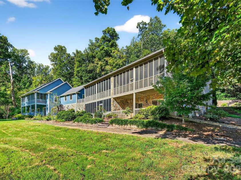 307 #7 Blue Ridge Drive, Marion, NC 28752.  MLS# CAR4298364, YatesRealty ID 28. Golf course side of unit, Main level screened lower level open patio.