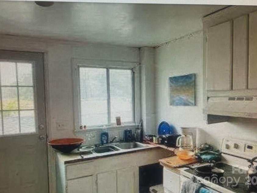 209 Edgewood Drive, Wingate, NC 28174.  MLS# CAR4285232, YatesRealty ID 28008. Upper Kitchen