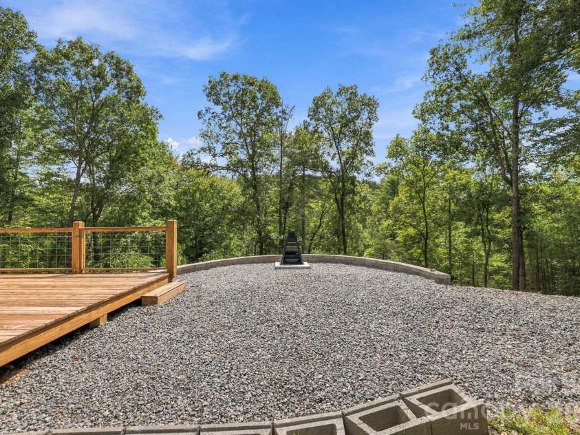 678 Forest Lake Heights Drive, Nebo, NC 28761.  MLS# CAR4424103, YatesRealty ID 28013. Fire pit in front