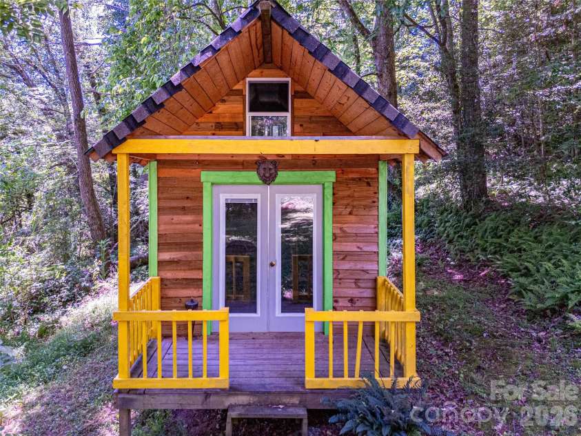 73 Cresent Drive, Pisgah Forest, NC 28768.  MLS# CAR4382489, YatesRealty ID 28014. Backyard Playhouse