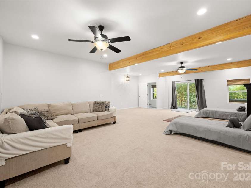 1308 Bell Mountain Road, Zirconia, NC 28790.  MLS# CAR4317514, YatesRealty ID 2802. Great room open to back patio 