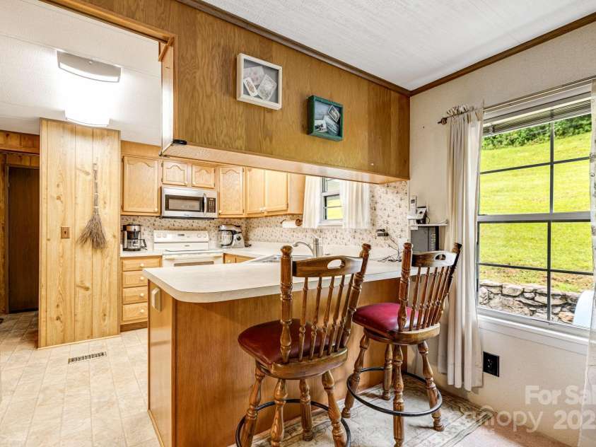 582 Lewis Branch Road, Marshall, NC 28753.  MLS# CAR4284450, YatesRealty ID 28023. 