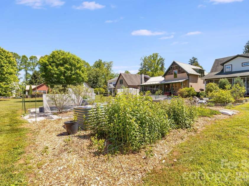 99999 Verde Drive, Asheville, NC 28806.  MLS# CAR4381556, YatesRealty ID 28023. Enjoy a harvest from the community garden!