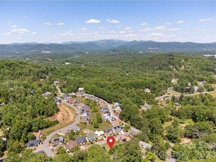 99999 Verde Drive, Asheville, NC 28806.  MLS# CAR4381556, YatesRealty ID 28023. The Villages at Crest Mountain. Asheville’s Premier Sustainable Eco-Community—a pocket neighborhood minutes from downtown, yet a haven nestled among the trees.