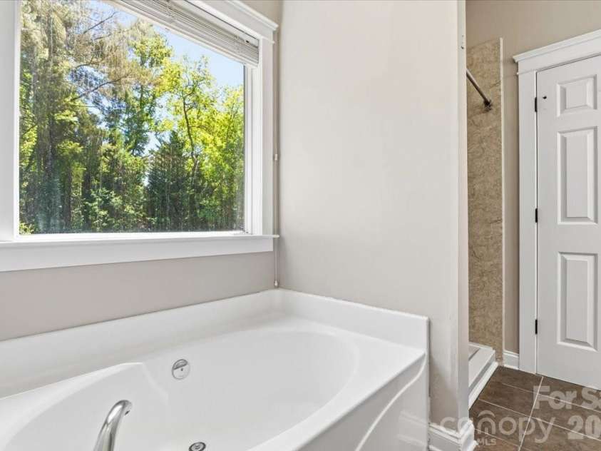 126 Carolina Bluebird Loop, Arden, NC 28704.  MLS# CAR4364125, YatesRealty ID 28030. Primary bath