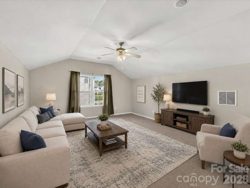 1788 Oakmont Drive, Denver, NC 28037.  MLS# CAR4388183, YatesRealty ID 28036. Concept Photo - Virtually Staged expansive bonus room with vaulted ceilings and endless flexibility, offering the perfect space for a media room, playroom, home gym, or additional living area.