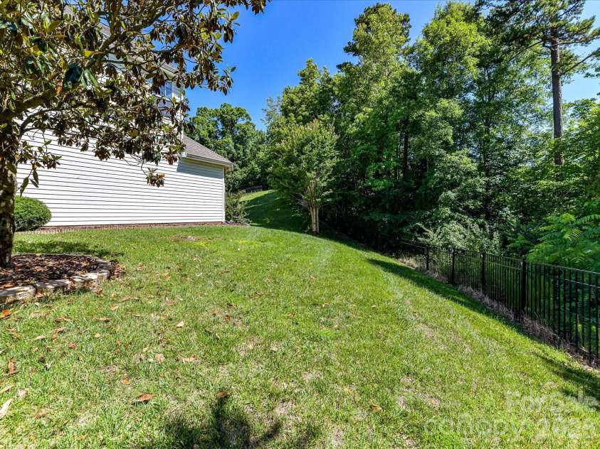 1788 Oakmont Drive, Denver, NC 28037.  MLS# CAR4388183, YatesRealty ID 28036. Spacious level side yard!