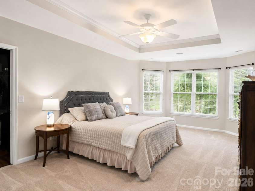 1788 Oakmont Drive, Denver, NC 28037.  MLS# CAR4388183, YatesRealty ID 28036. Spacious primary suite featuring a tray ceiling, abundant natural light, a cozy sitting area, and plenty of room to create your own private retreat.