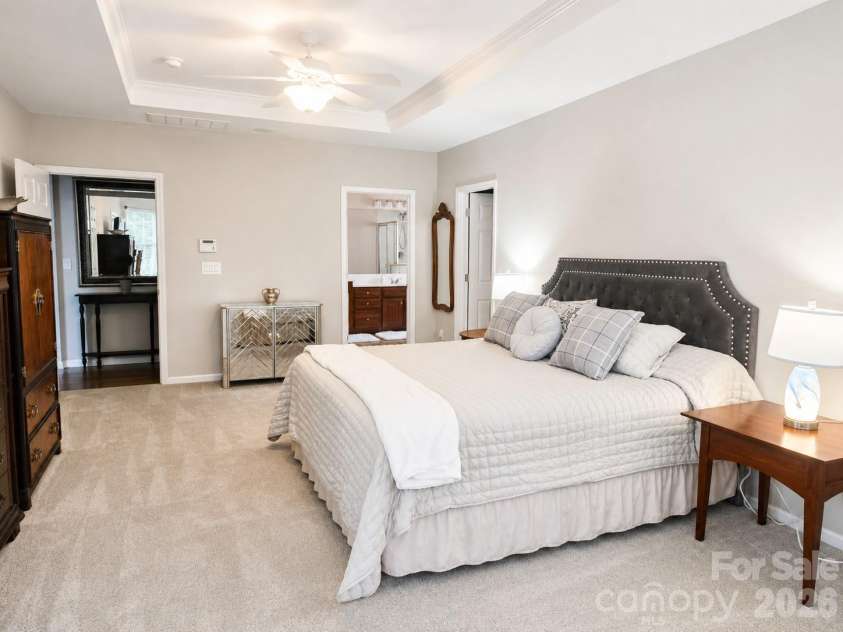 1788 Oakmont Drive, Denver, NC 28037.  MLS# CAR4388183, YatesRealty ID 28036. Spacious primary suite featuring a tray ceiling, abundant natural light, a cozy sitting area, and plenty of room to create your own private retreat.