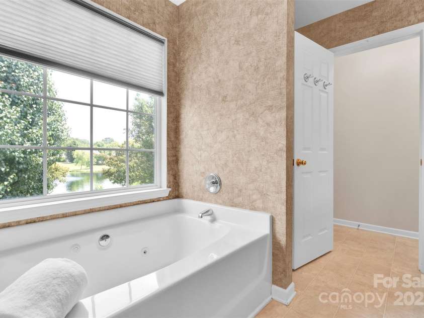 2004 Onotoa Drive, Indian Trail, NC 28079.  MLS# CAR4272970, YatesRealty ID 28047. Primary bath pond views