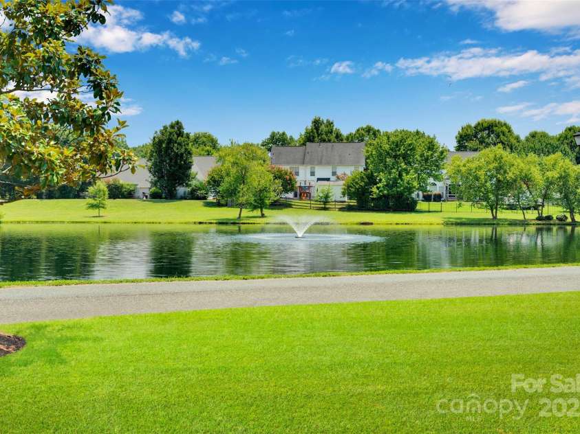 2004 Onotoa Drive, Indian Trail, NC 28079.  MLS# CAR4272970, YatesRealty ID 28047. The pond is right outside the back fence!