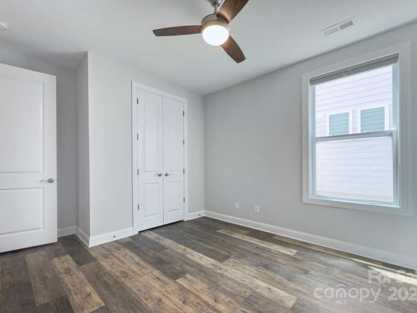 5527 Cheerful Lane, Charlotte, NC 28215.  MLS# CAR4275434, YatesRealty ID 28049. Bedroom 2-- separate from the primary bedroom for privacy, ceiling fan and closet 