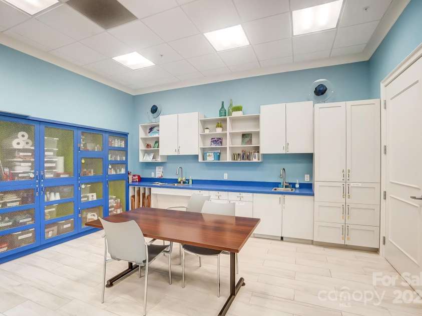 5527 Cheerful Lane, Charlotte, NC 28215.  MLS# CAR4275434, YatesRealty ID 28049. Crafting room in clubhouse- 