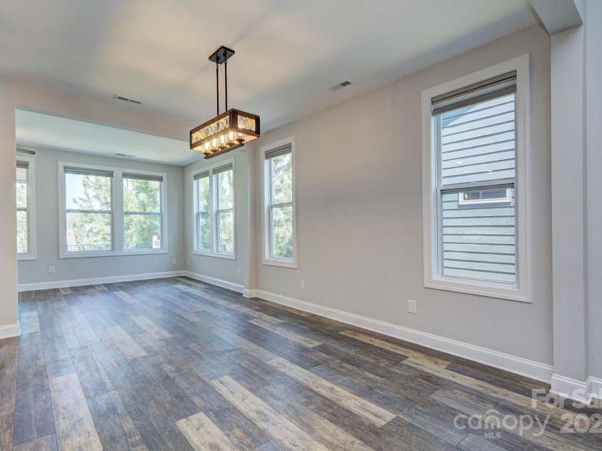 5527 Cheerful Lane, Charlotte, NC 28215.  MLS# CAR4275434, YatesRealty ID 28049. Dining area looking into the extended sunroom