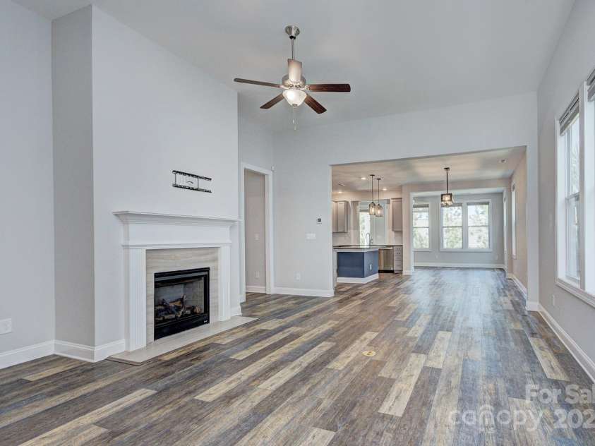 5527 Cheerful Lane, Charlotte, NC 28215.  MLS# CAR4275434, YatesRealty ID 28049. Large Family room- ceiling fan, fireplace with gas logs, TV bracket remains  