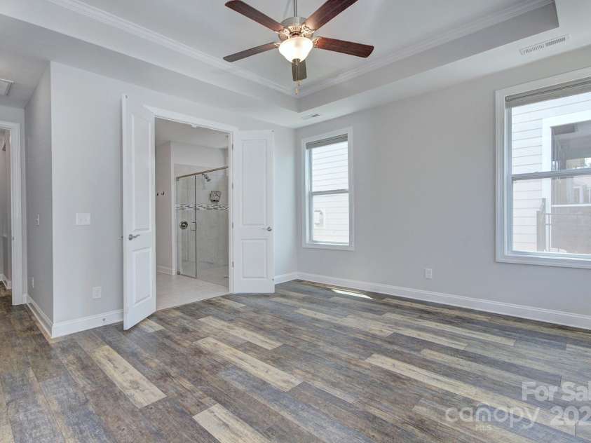 5527 Cheerful Lane, Charlotte, NC 28215.  MLS# CAR4275434, YatesRealty ID 28049. Primary bedroom- double door entry into the primary bathroom
