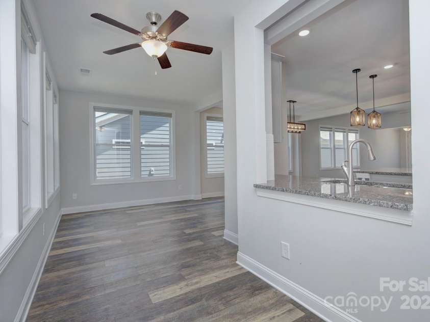 5527 Cheerful Lane, Charlotte, NC 28215.  MLS# CAR4275434, YatesRealty ID 28049. Sunroom area near back door- has a pass through from the kitchen for easy entertaining