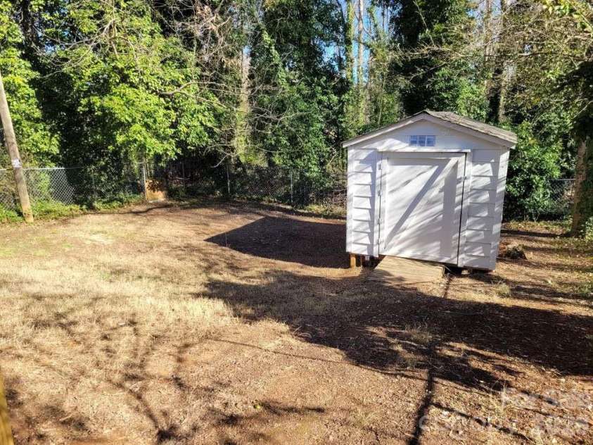1116 East Drive, Gastonia, NC 28052.  MLS# CAR4353217, YatesRealty ID 2805. Storage Building and Backyard
