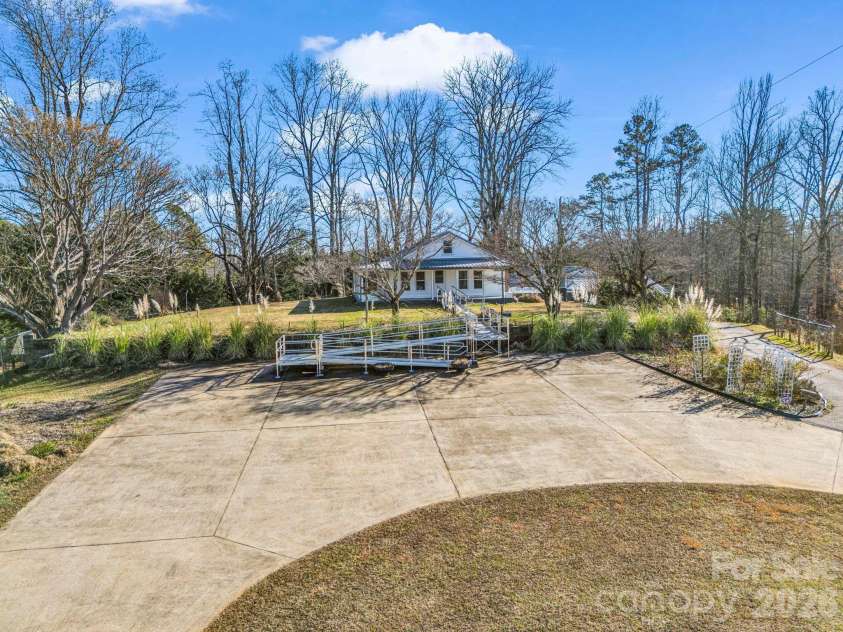 620 Smith Waldrop Road, Columbus, NC 28722.  MLS# CAR4379535, YatesRealty ID 28052. Concrete circular parking