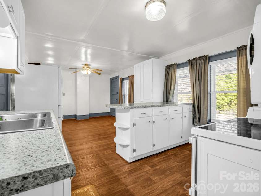 620 Smith Waldrop Road, Columbus, NC 28722.  MLS# CAR4379535, YatesRealty ID 28052. Kitchen opens to dining area