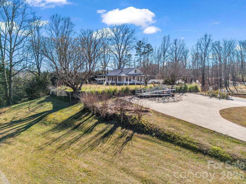 620 Smith Waldrop Road, Columbus, NC 28722.  MLS# CAR4379535, YatesRealty ID 28052. Left side yard