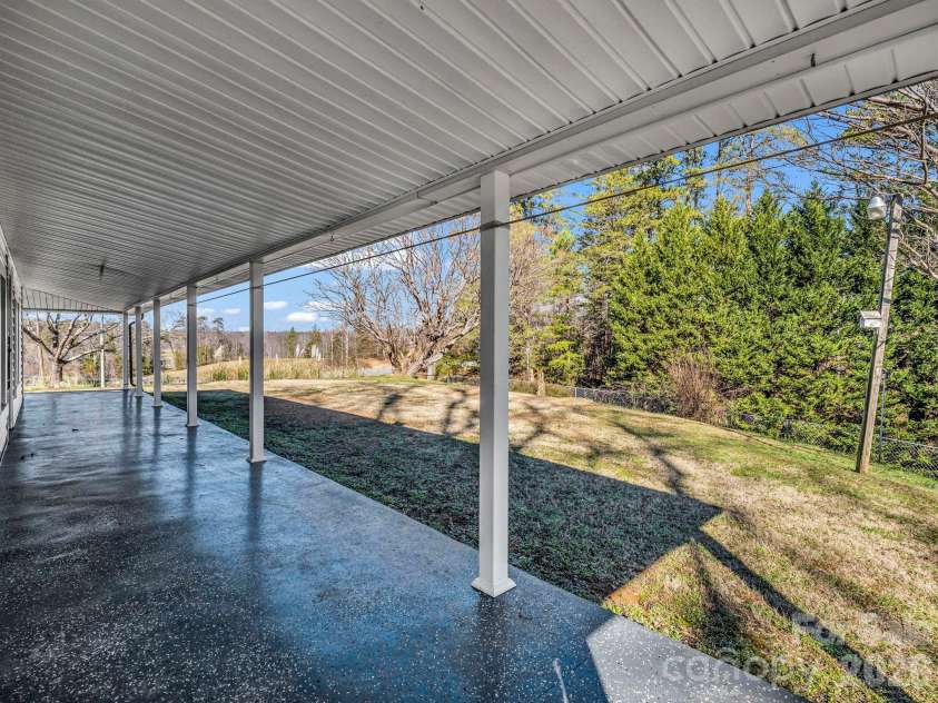 620 Smith Waldrop Road, Columbus, NC 28722.  MLS# CAR4379535, YatesRealty ID 28052. Wrap-around porch