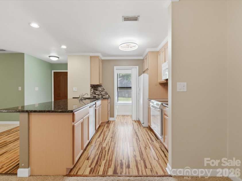 1011 Cranberry Circle, Fort Mill, SC 29715.  MLS# CAR4388076, YatesRealty ID 28053. Beautiful kitchen featuring a gorgeous ceiling fan with special lighting.