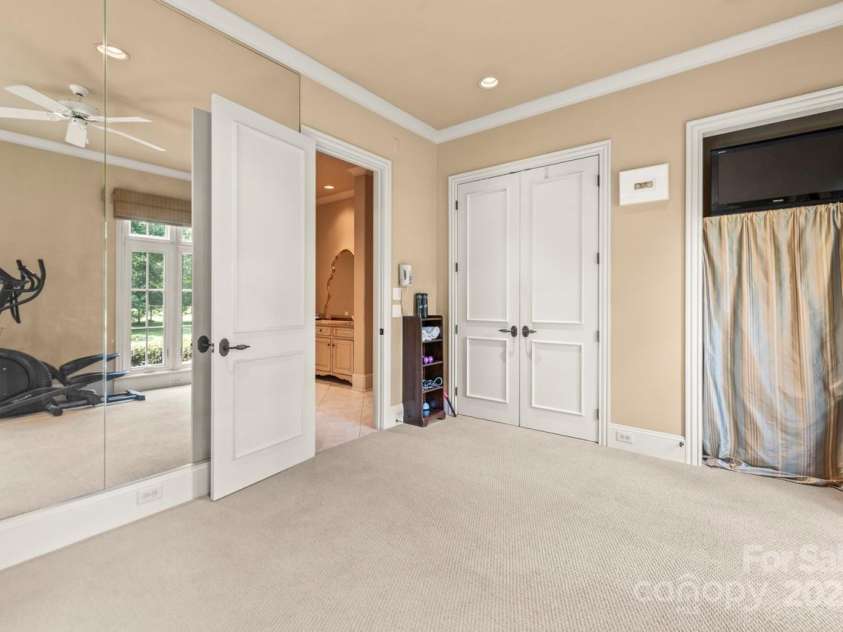 343 Wester Brewlands Road, Iron Station, NC 28080.  MLS# CAR4284507, YatesRealty ID 28060. 4th Bedroom in the Primary Wing! Located within the private primary wing, this light-filled flex space with mirrored walls and serene views is perfect for a home gym, yoga studio, or creative retreat and featu