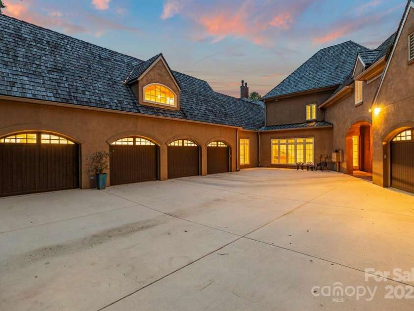 343 Wester Brewlands Road, Iron Station, NC 28080.  MLS# CAR4284507, YatesRealty ID 28060. An impressive motor court offers access to the oversized 5-car garage ideal for collectors or hobbyists! The single garage is heated and cooled and makes a great workshop
