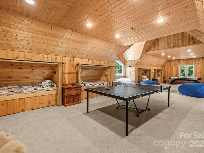343 Wester Brewlands Road, Iron Station, NC 28080.  MLS# CAR4284507, YatesRealty ID 28060. Bonus Room with Built-In Bunk Beds! A rustic retreat with cedar-paneled walls, built-in bunk beds, and plenty of space to play—this versatile bonus room is perfect for sleepovers, crafts, or a cozy camp-style 