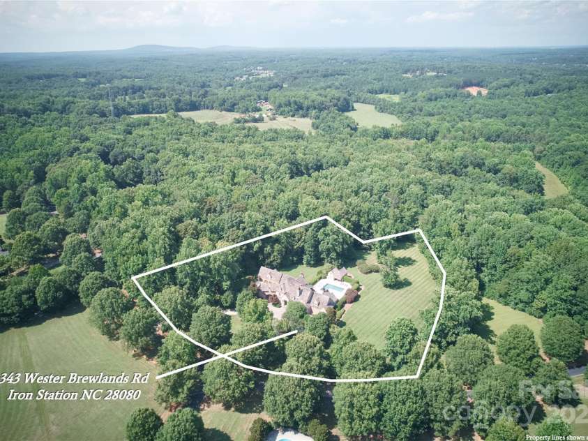 343 Wester Brewlands Road, Iron Station, NC 28080.  MLS# CAR4284507, YatesRealty ID 28060. Commanding Aerial Showcase of the Estate! Overview of this majestic French Provincial estate positioned to offer the perfect balance of privacy, luxury, and elegance. Property lines are estimated for visual re
