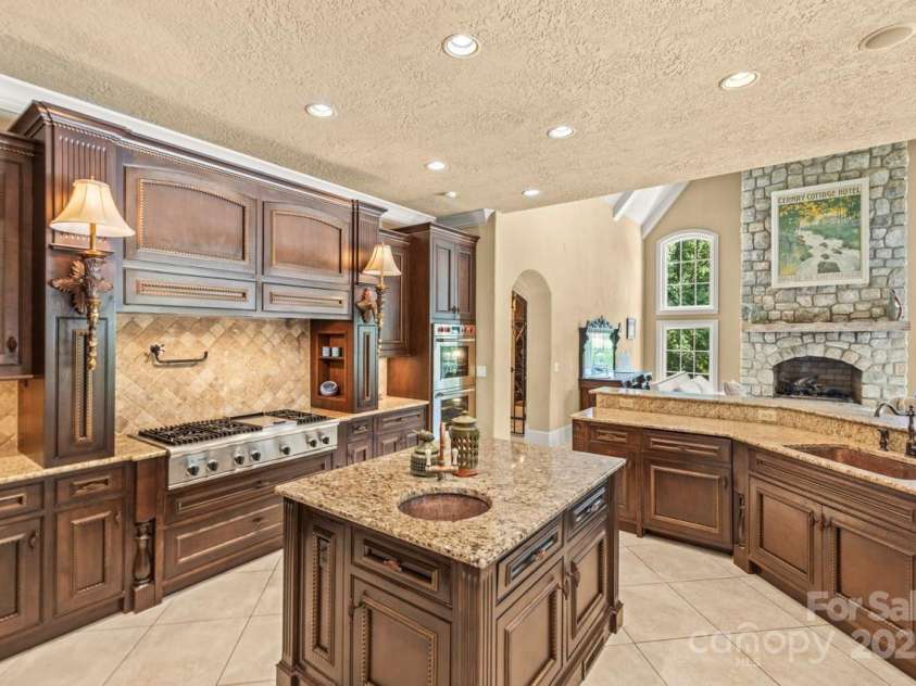 343 Wester Brewlands Road, Iron Station, NC 28080.  MLS# CAR4284507, YatesRealty ID 28060. Extravagant Kitchen! Enjoy custom-crafted cabinetry, granite countertops, a separate prep island, and professional-grade appliances, including a warming drawer, Wolf double ovens and a Bosch dishwasher install
