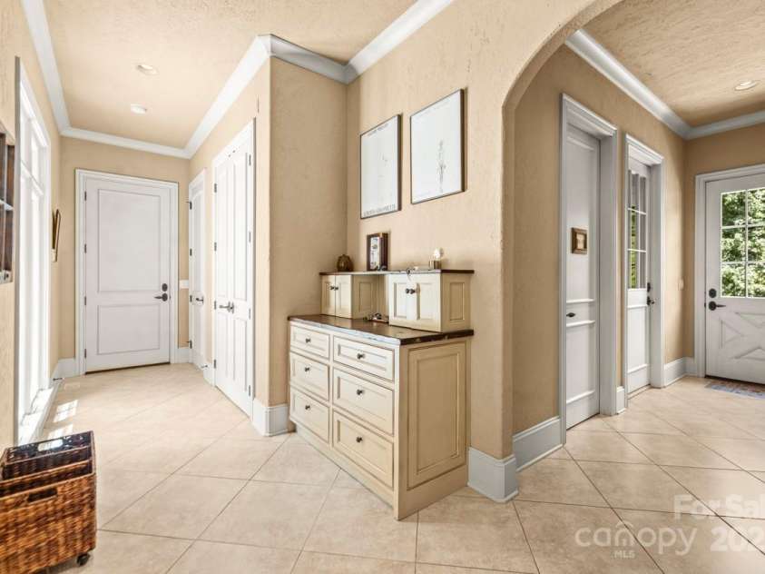 343 Wester Brewlands Road, Iron Station, NC 28080.  MLS# CAR4284507, YatesRealty ID 28060. Form Meets Function in Every Corner! This thoughtfully integrated hallway desk offers a dedicated drop zone and charging station, perfect for managing daily life with ease. Surrounded by artisan wall textures 