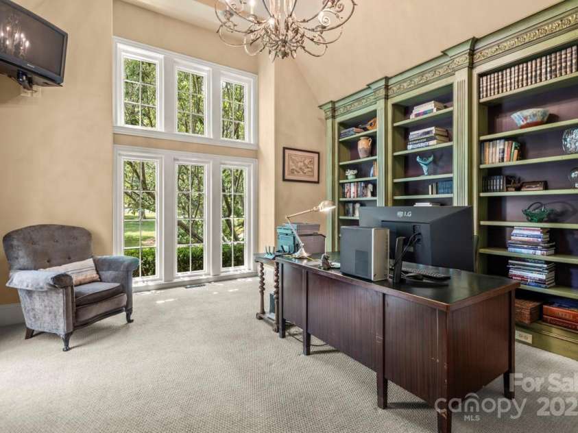 343 Wester Brewlands Road, Iron Station, NC 28080.  MLS# CAR4284507, YatesRealty ID 28060. Highly desired 2nd home office on the main level! Rich built-in cabinetry adds functionality and practically to this space. Walk out to the private courtyard for a peaceful rewind.