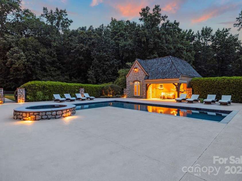 343 Wester Brewlands Road, Iron Station, NC 28080.  MLS# CAR4284507, YatesRealty ID 28060. Luxury Outdoor Living! Resort-style amenities include a sparkling heated pool with attached spa, pool house with full bath, shower, and changing area