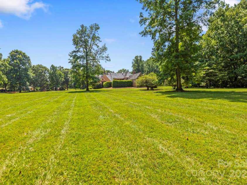 343 Wester Brewlands Road, Iron Station, NC 28080.  MLS# CAR4284507, YatesRealty ID 28060. Room to Roam, Space to Breathe! Tucked into a park-like setting, this expansive level backyard offers endless possibilities—from backyard sports to garden parties. Surrounded by mature trees, it provides priva