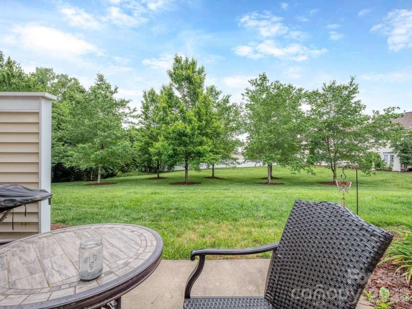 3064 Priory Ridge Drive, Fort Mill, SC 29707.  MLS# CAR4385929, YatesRealty ID 28063. Green space beyond patio
