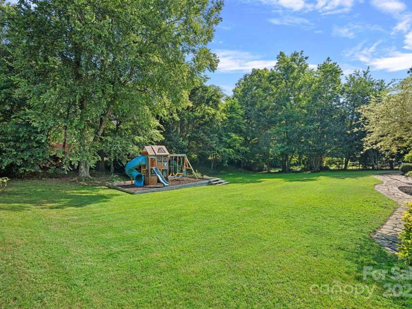 343 Gringley Hill Road, Fort Mill, SC 29708.  MLS# CAR4274138, YatesRealty ID 28068. Back Yard and Playset
