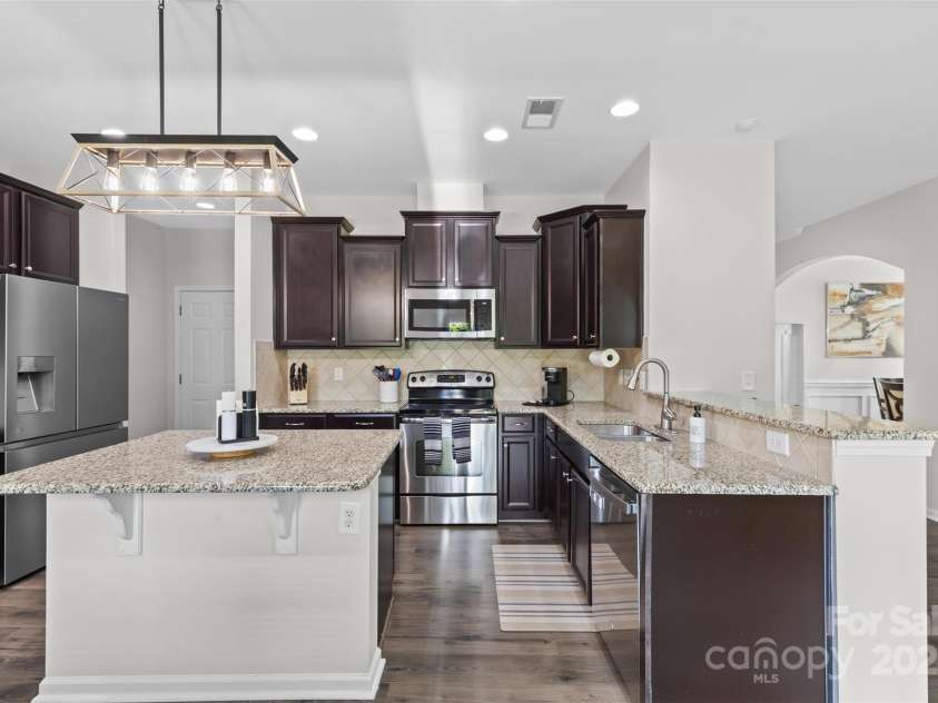 2042 Newport Drive, Fort Mill, SC 29707.  MLS# CAR4257730, YatesRealty ID 28069. Kitchen Island, sleek features and granite countertops