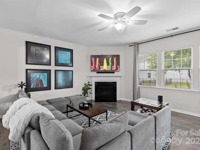2042 Newport Drive, Fort Mill, SC 29707.  MLS# CAR4257730, YatesRealty ID 28069. Living room featuring gas fireplace