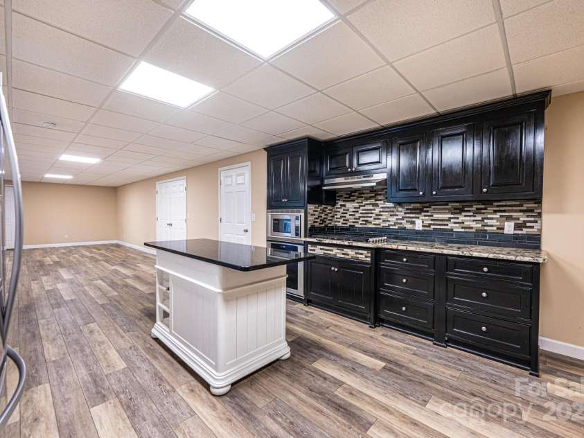 1436 20th Avenue Place, Hickory, NC 28601.  MLS# CAR4324813, YatesRealty ID 2807. Basement Kitchen