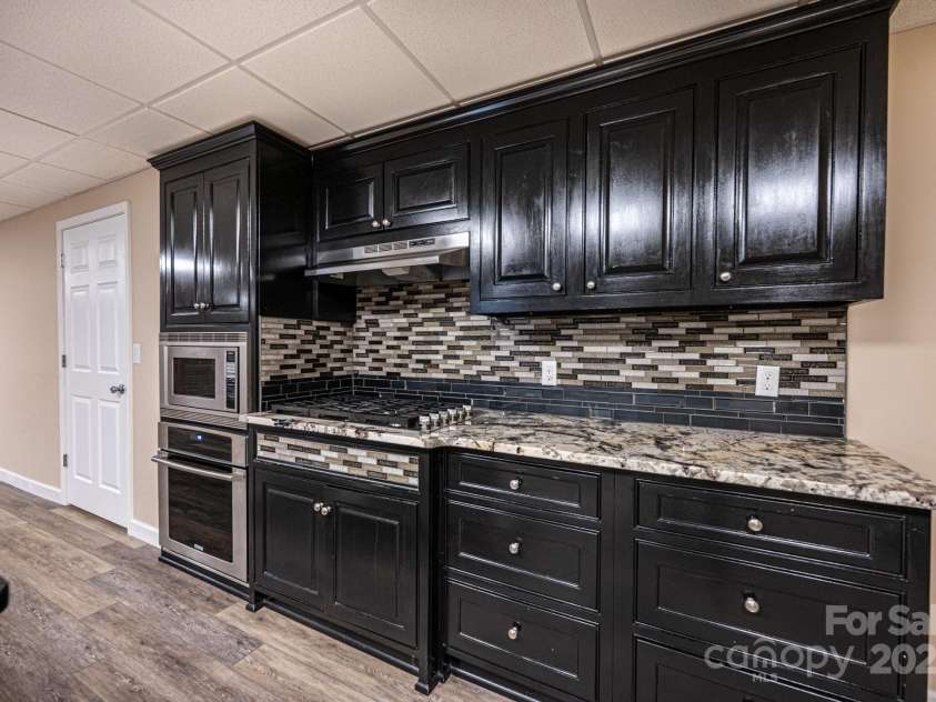 1436 20th Avenue Place, Hickory, NC 28601.  MLS# CAR4324813, YatesRealty ID 2807. Basement Kitchen