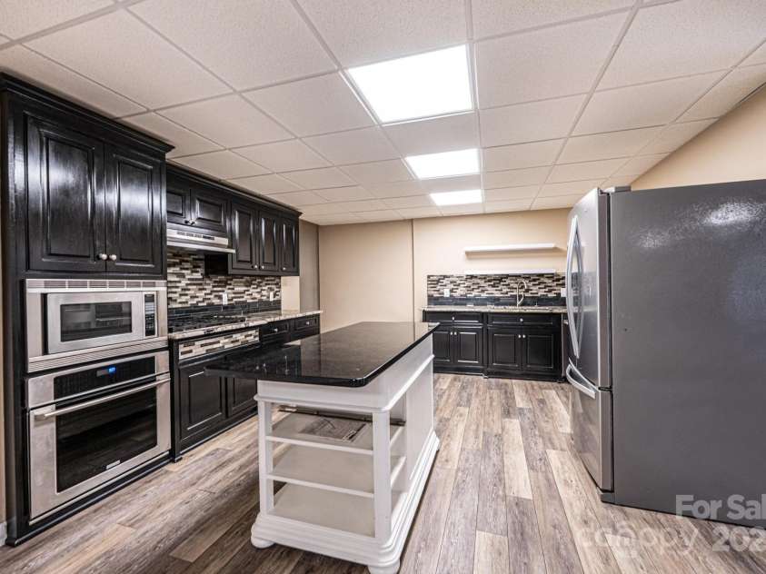 1436 20th Avenue Place, Hickory, NC 28601.  MLS# CAR4324813, YatesRealty ID 2807. Basement Kitchen