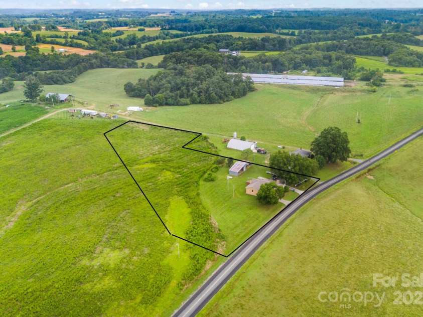 20661 Sam Road, Albemarle, NC 28001.  MLS# CAR4279879, YatesRealty ID 28070. New survey will adjust property to 3+/- acres. These lines are a represenation of the three acres. Corners are marked.