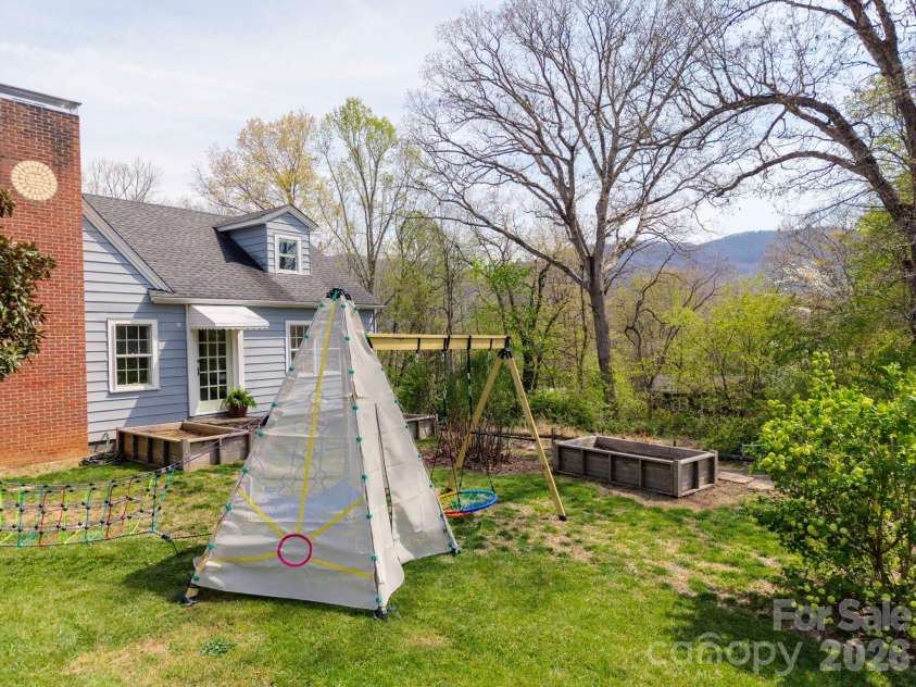318 Stonewall Avenue, Swannanoa, NC 28778.  MLS# CAR4368730, YatesRealty ID 28078. Side Yard Views!