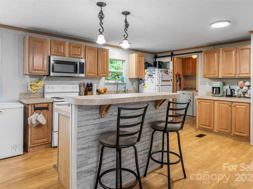 118 Reeves Road, Leicester, NC 28748.  MLS# CAR4280942, YatesRealty ID 28083. Spacious kitchen with pantry closet