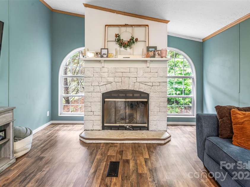 118 Reeves Road, Leicester, NC 28748.  MLS# CAR4280942, YatesRealty ID 28083. Wood burning fireplace in family room