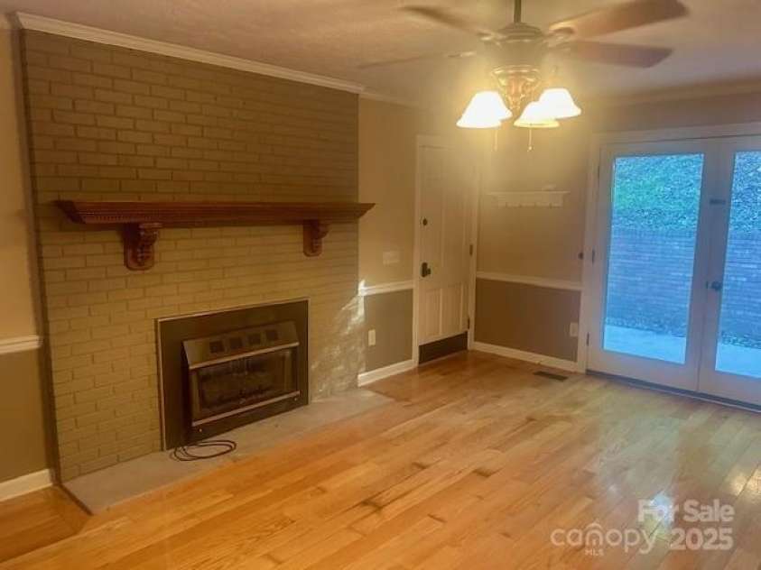 252 Deerfield Street, Lenoir, NC 28645.  MLS# CAR4285316, YatesRealty ID 28086. Living room fireplace